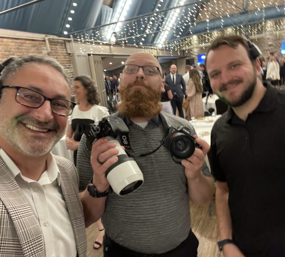 Founder Joe Perrock and colleagues takes a selfie at a successful formal event.