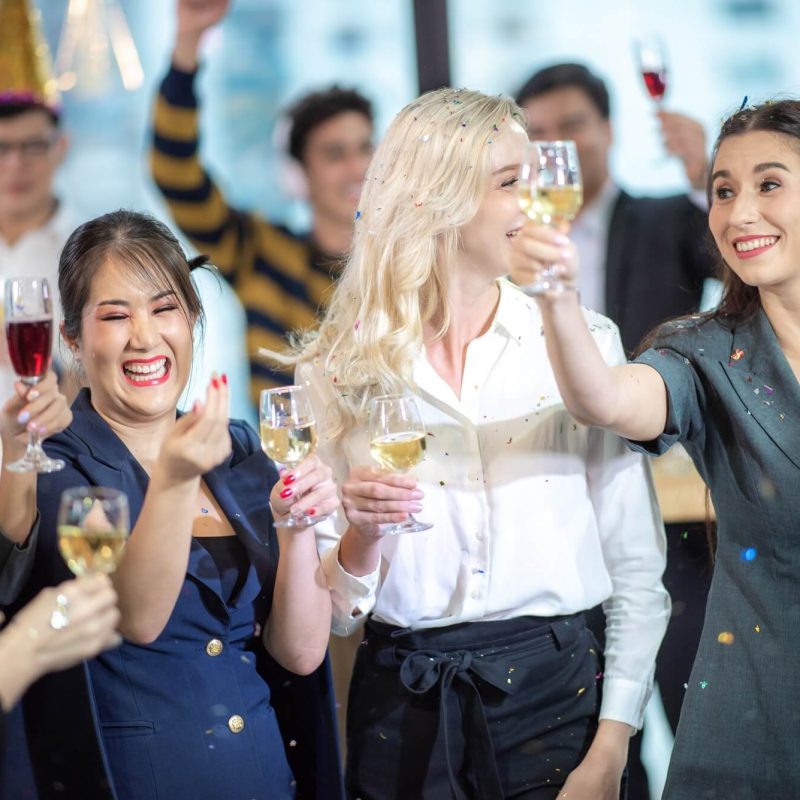 business partners toast champagne company event celebration success